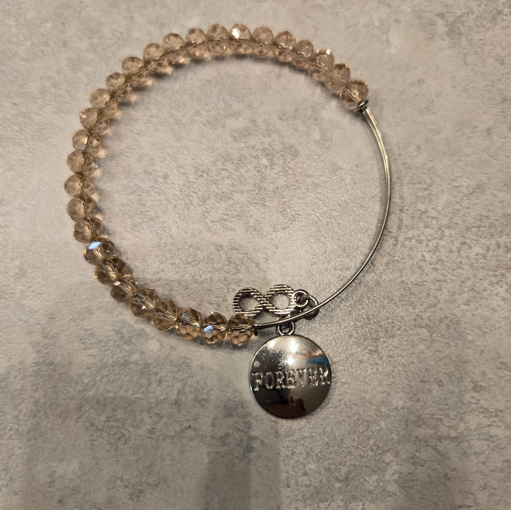 Beautiful champagne sparkly beaded silver bracelet with forever charms